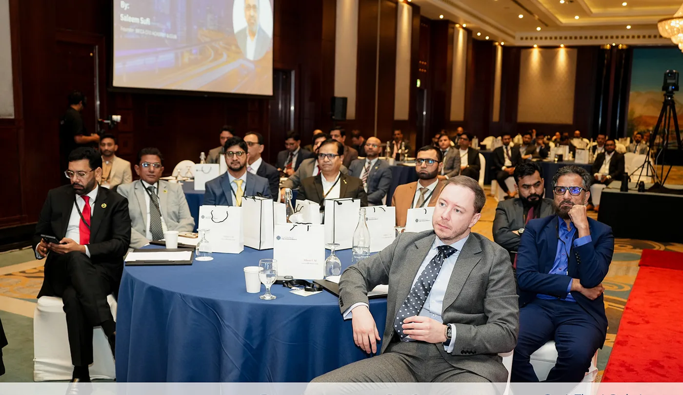 Delegates at summit tables during a keynote